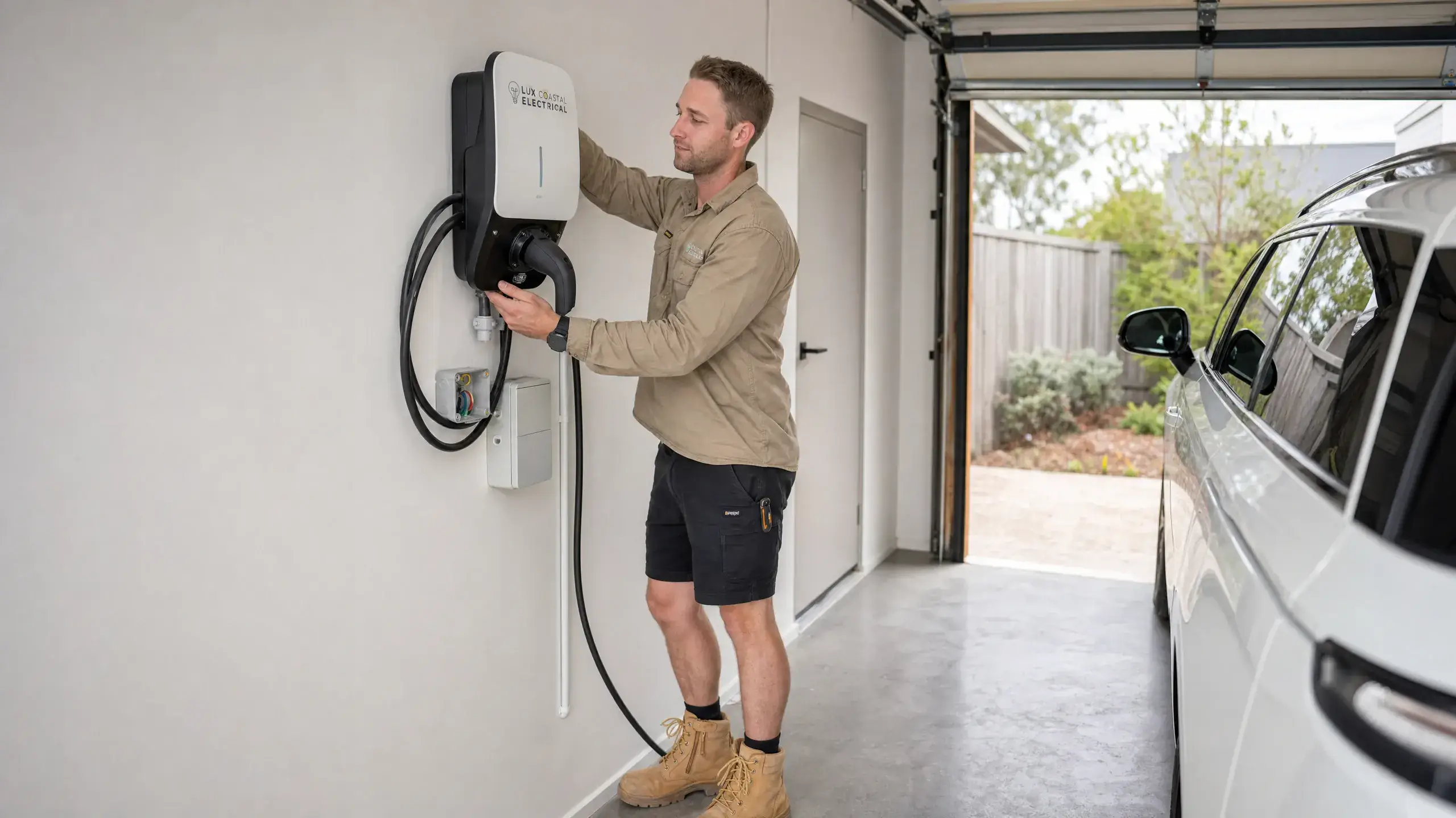 Lux Coastal Electrical installing a home EV charger in a garage